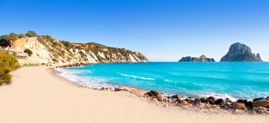 Cala d’Hort beach overlooking Es Vedra in Ibiza